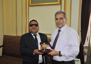 The First Researcher from those with Special Needs to Receive a PhD. in Media Is Presented the University's Shield by President of Cairo University